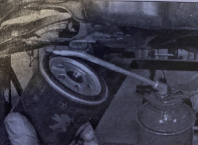 applying engine oil to filter